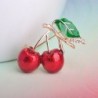 Elegant brooch with a red crystal cherryBrooches