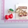 Elegant brooch with a red crystal cherryBrooches