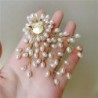 Branch with oval pearls - fashionable broochBrooches