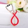 Stethoscope shaped brooch with crystalBrooches