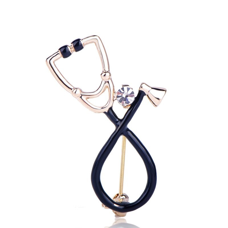 Stethoscope shaped brooch with crystalBrooches