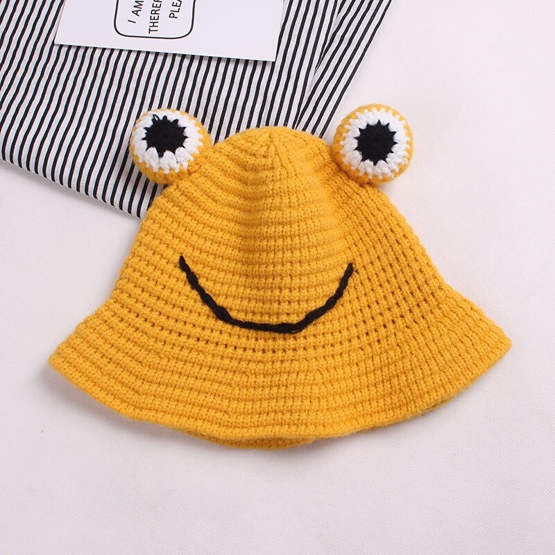 Warm knitted hat - bucket style - with toad's eyesHats & caps