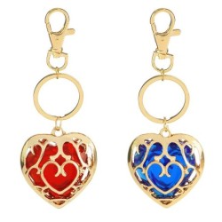 Crystal heart in golden cage - keychainKeyrings