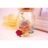 Golden crystal skull with rose - keychainKeyrings