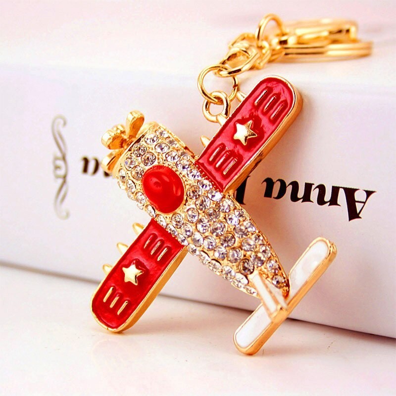 Crystal airplane - gold keychainKeyrings