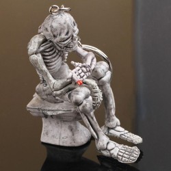 Skeleton sitting on the toilet - rubber keychainKeyrings
