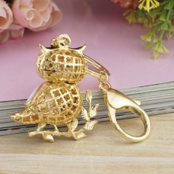 Sitting on the branch white crystal owl - keychainKeyrings