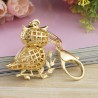 Sitting on the branch white crystal owl - keychainKeyrings