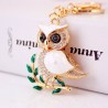 Sitting on the branch white crystal owl - keychainKeyrings