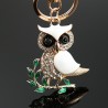 Sitting on the branch white crystal owl - keychainKeyrings