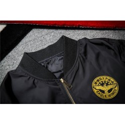 Black bomber jacket with embroidered golden wingsJackets
