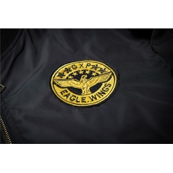 Black bomber jacket with embroidered golden wingsJackets