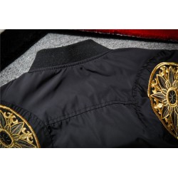 Black bomber jacket with embroidered golden wingsJackets