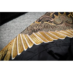 Black bomber jacket with embroidered golden wingsJackets