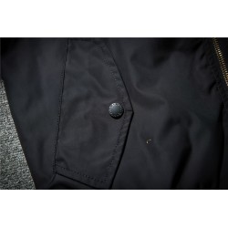 Black bomber jacket with embroidered golden wingsJackets