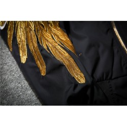Black bomber jacket with embroidered golden wingsJackets