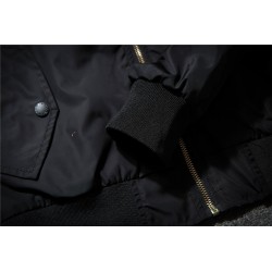 Black bomber jacket with embroidered golden wingsJackets
