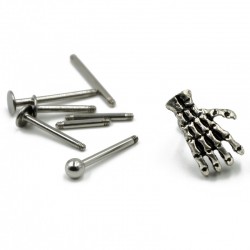 Body piercing with skull handEarrings