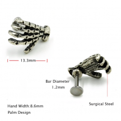 Body piercing with skull handEarrings